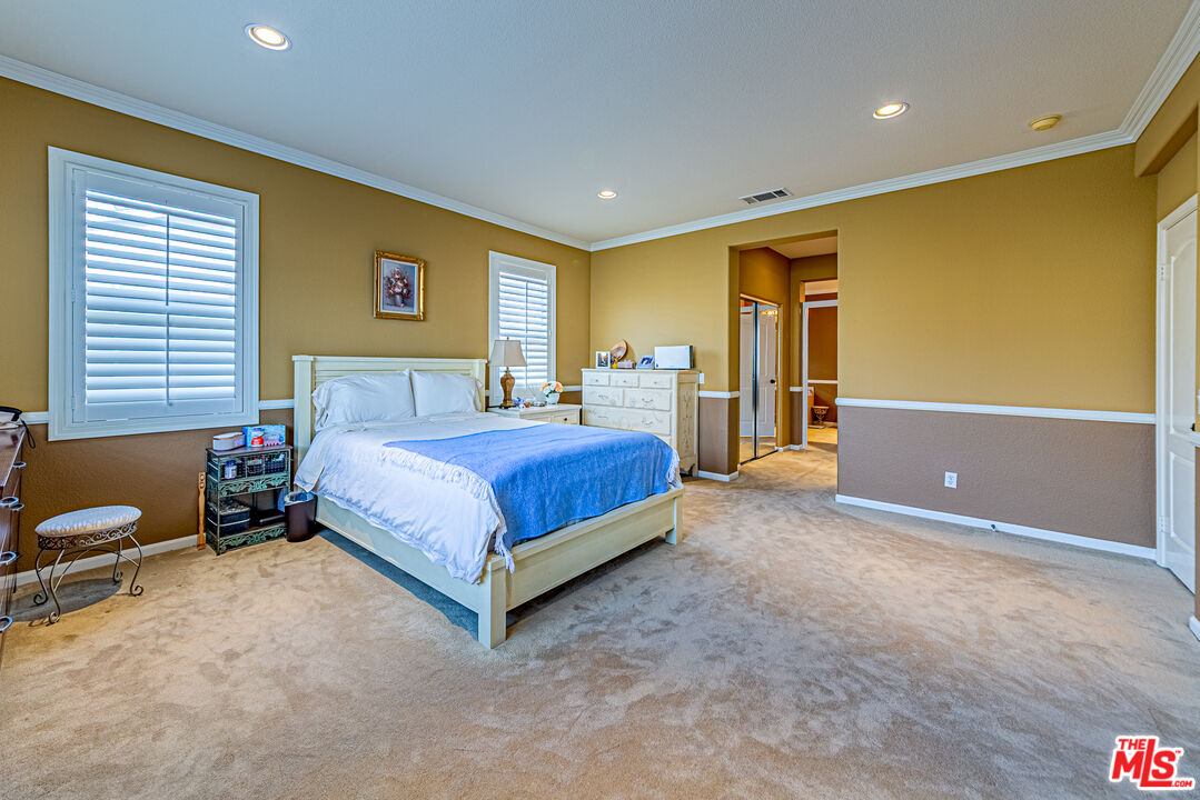 23208 Maple Avenue Torrance, CA 90505 - Photo 40 of 62 a bedroom with a bed and a couch