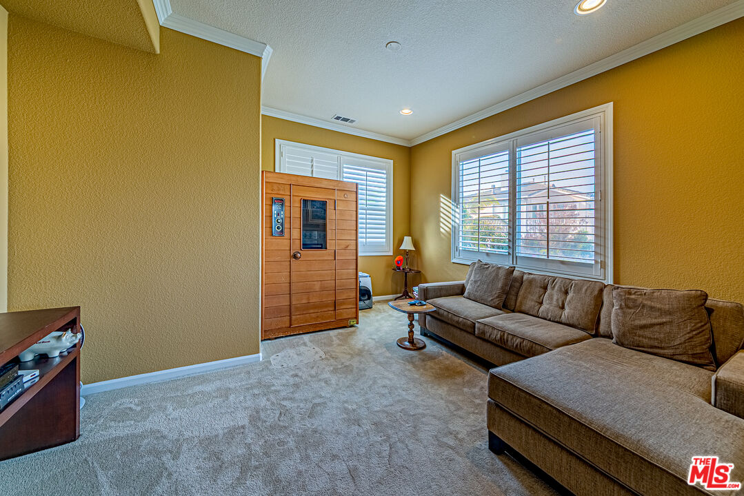 23208 Maple Avenue Torrance, CA 90505 - Photo 43 of 62 a living room with furniture and a flat screen tv