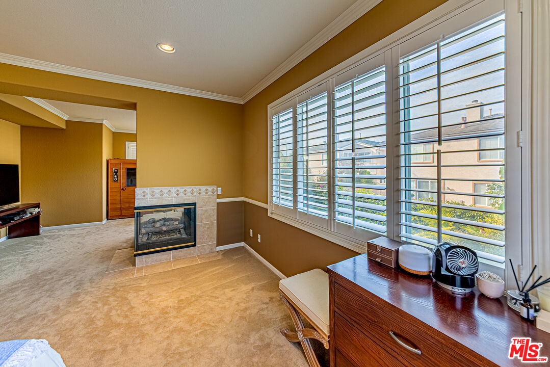 23208 Maple Avenue Torrance, CA 90505 - Photo 44 of 62 a living room with furniture and a flat screen tv