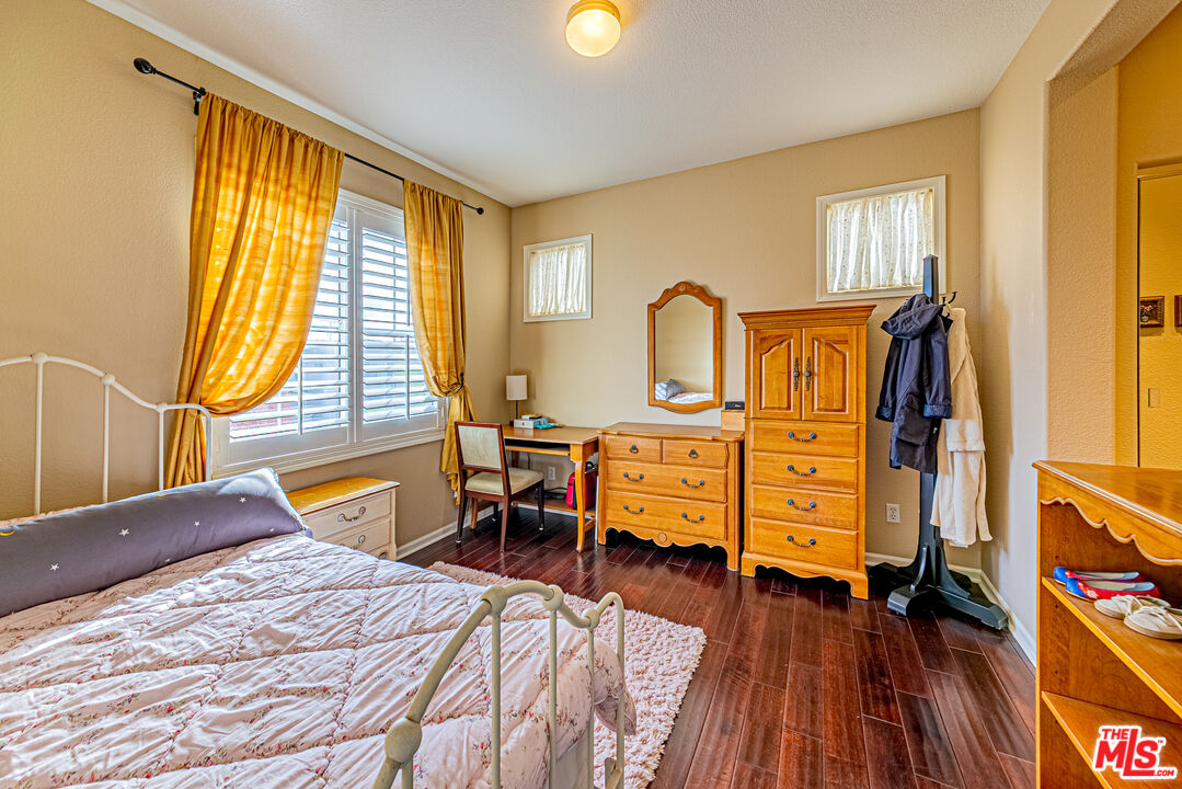 23208 Maple Avenue Torrance, CA 90505 - Photo 6 of 62 a bedroom with a bed and wooden floor