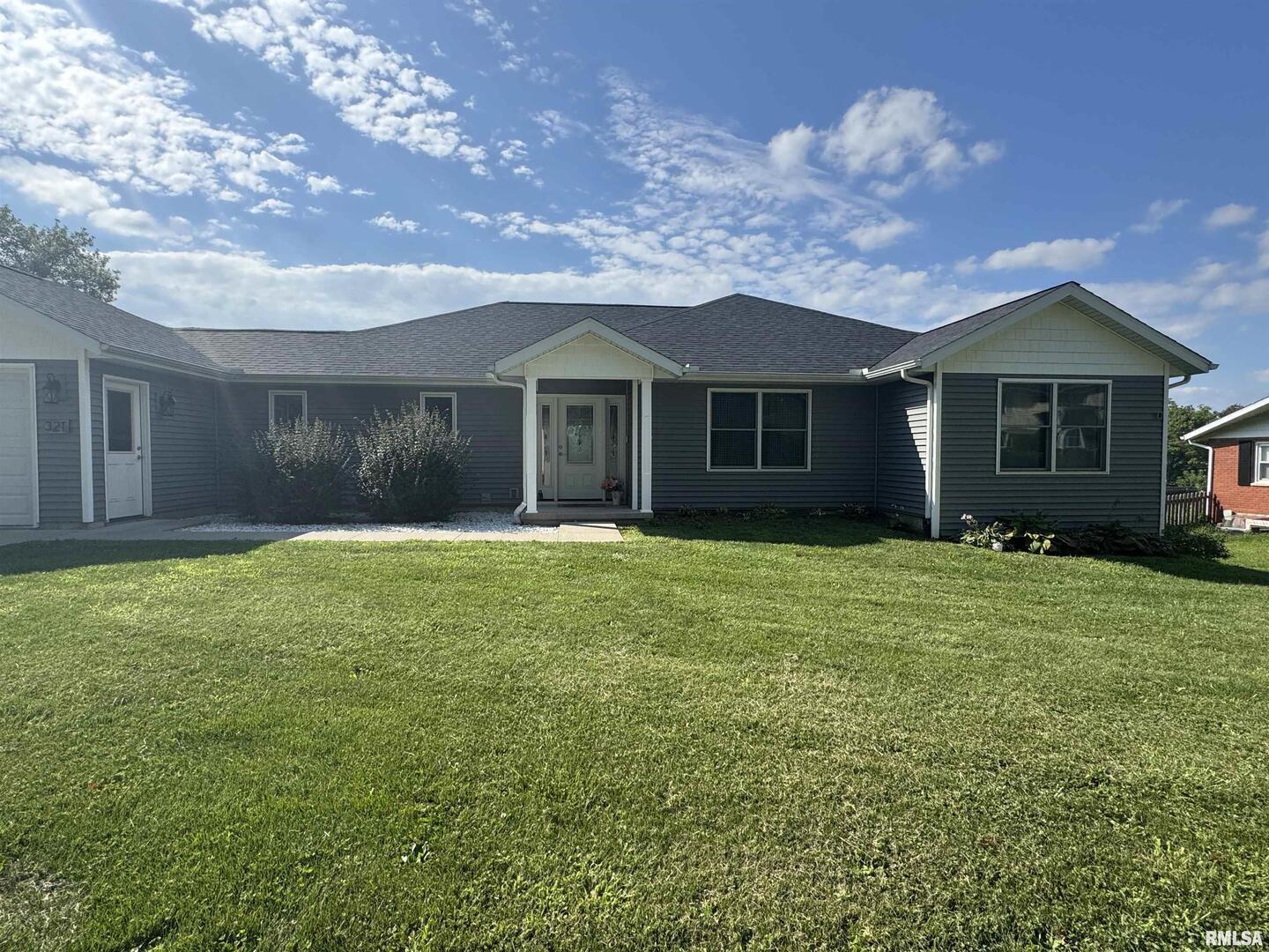 321 Pin Oak Drive Geneseo, IL 61254 - Photo 40 of 42 front view of a house with a garden