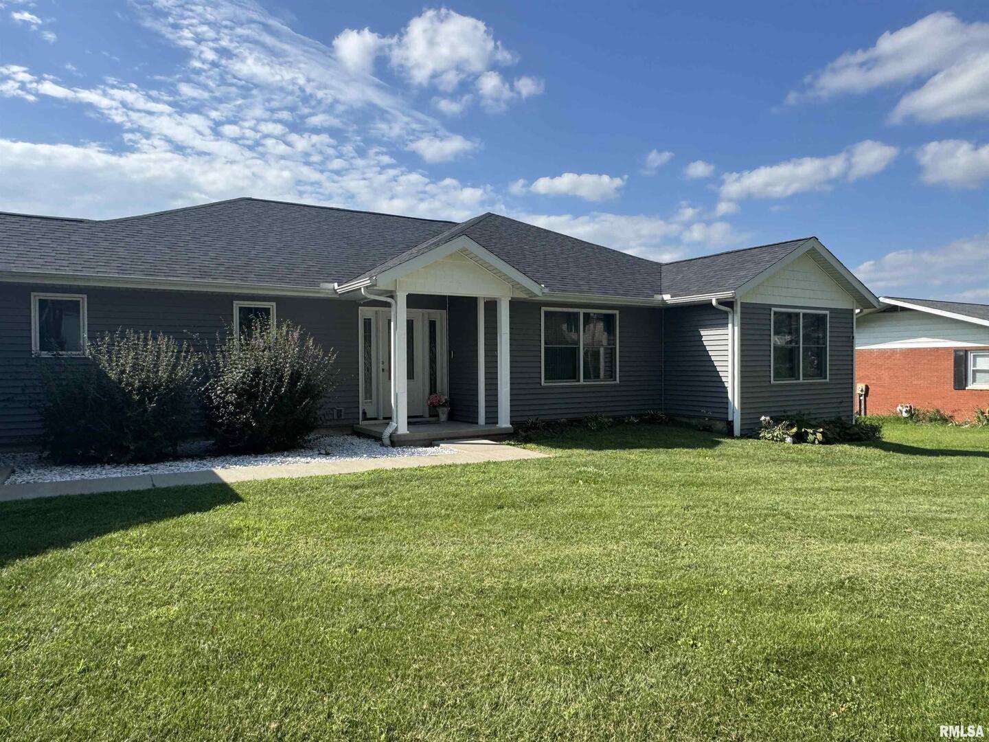 321 Pin Oak Drive Geneseo, IL 61254 - Photo 41 of 42 a front view of a house with a garden
