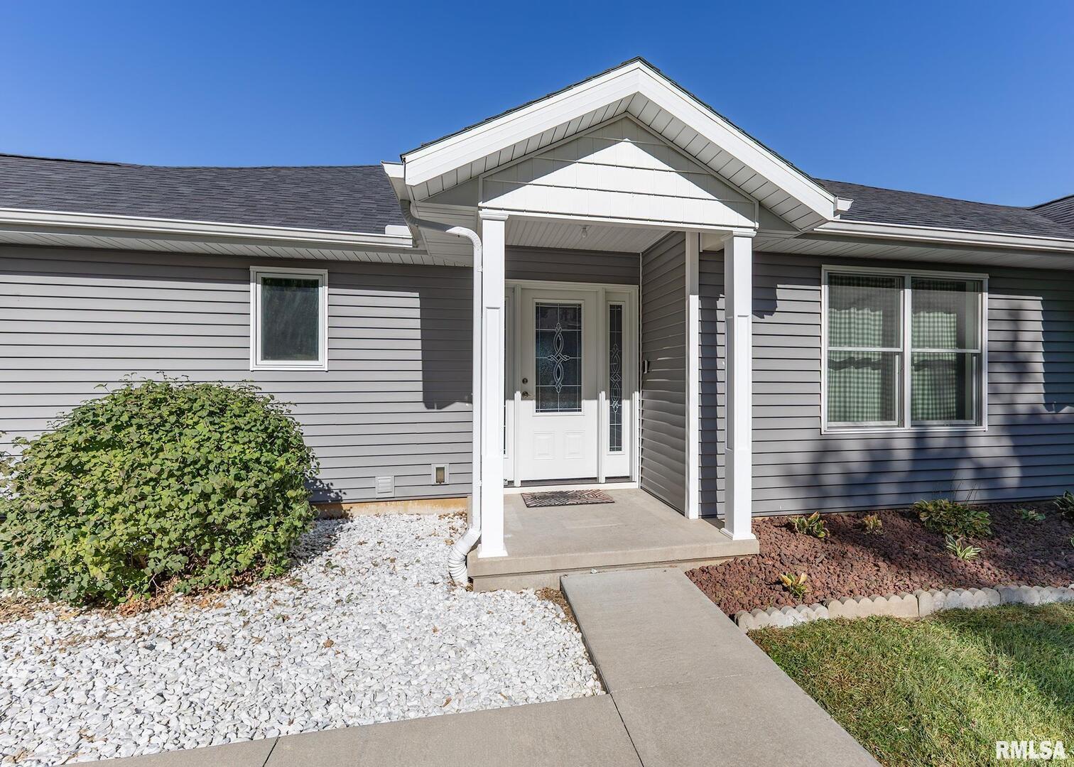 321 Pin Oak Drive Geneseo, IL 61254 - Photo 5 of 42 a front view of a house with a yard