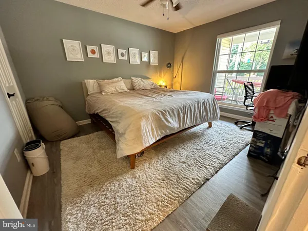 a bedroom with bed and window