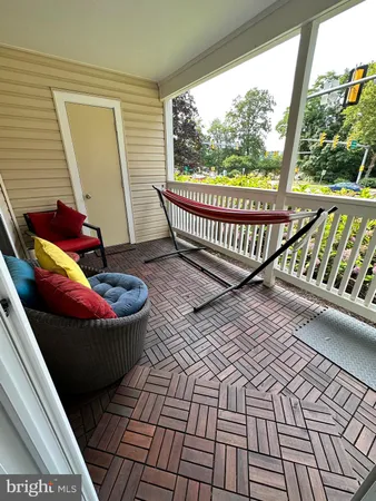 a view of a porch with wooden floor