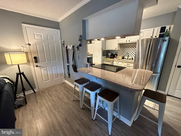 a view of a dining room with furniture and a window