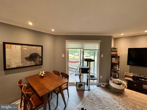 a view of a livingroom with furniture and a flat screen tv