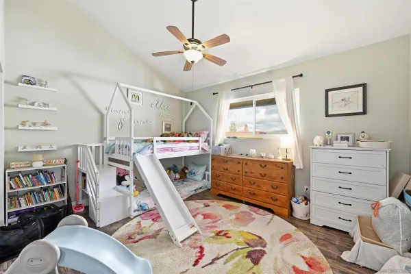 a bed room with a bed and a window