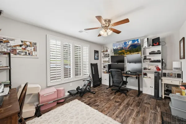 a bedroom with furniture and a window