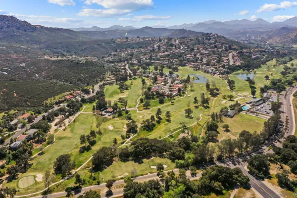 a view of a city with mountains in the background