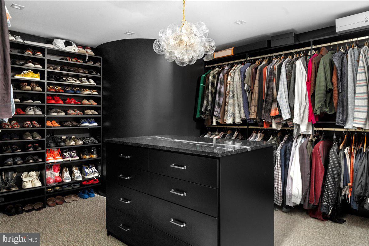 6450 Old Carversville Road New Hope, PA 18938 - Photo 41 of 89 a view of walk in closet with clothes and shoes