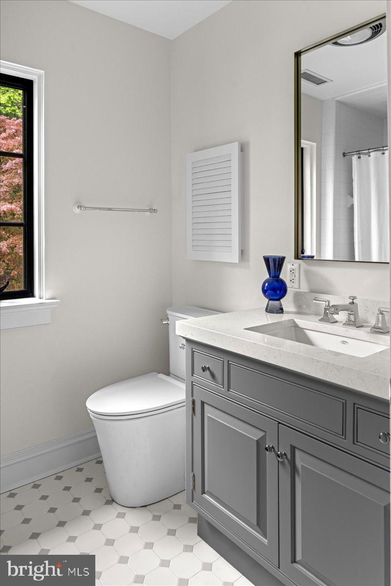 6450 Old Carversville Road New Hope, PA 18938 - Photo 48 of 89 a bathroom with a toilet sink and mirror