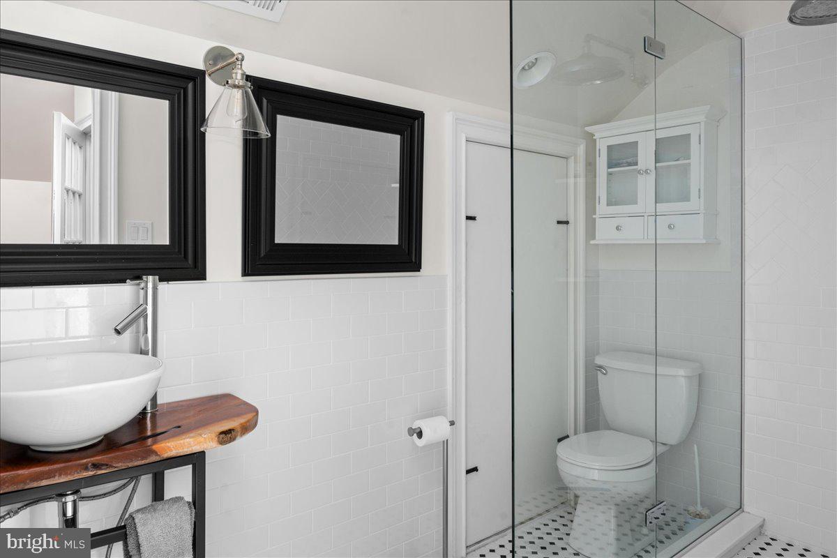 6450 Old Carversville Road New Hope, PA 18938 - Photo 57 of 89 a bathroom with a toilet a sink and a mirror