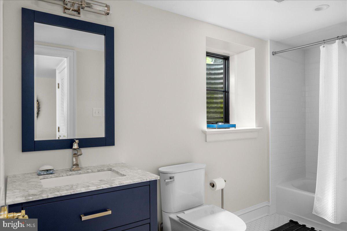 6450 Old Carversville Road New Hope, PA 18938 - Photo 61 of 89 a bathroom with a toilet sink and mirror