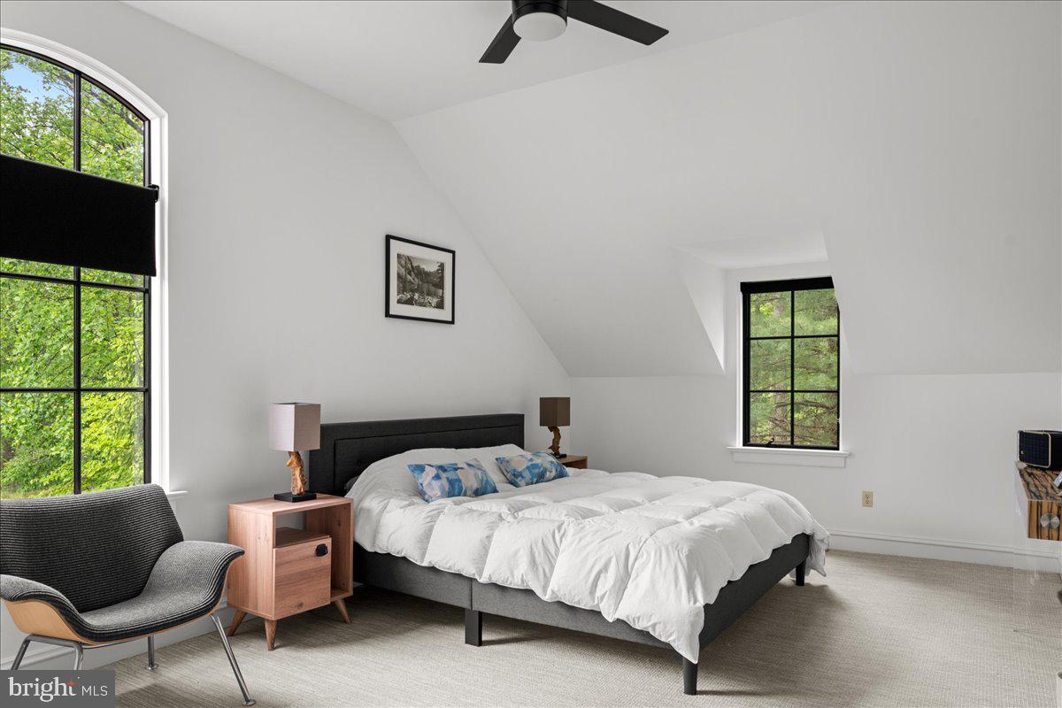 6450 Old Carversville Road New Hope, PA 18938 - Photo 80 of 89 a bedroom with a bed a couch and a window