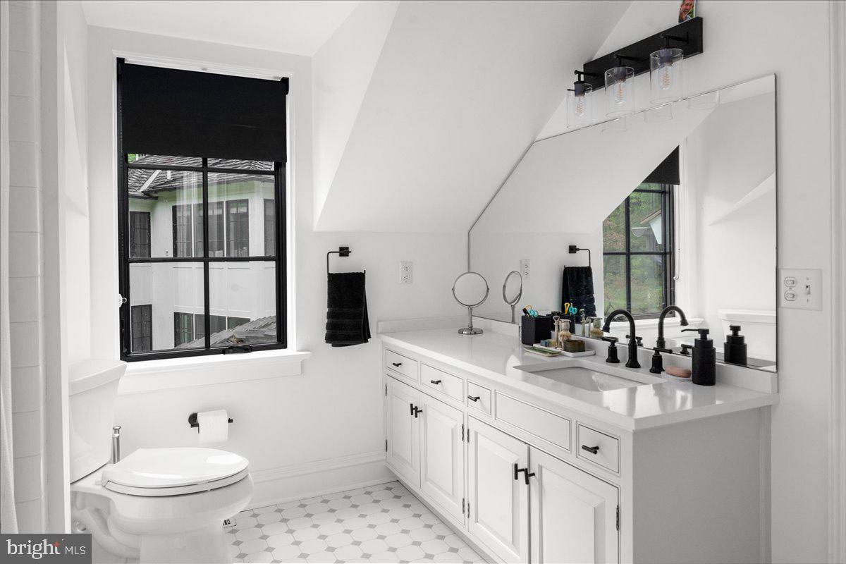 6450 Old Carversville Road New Hope, PA 18938 - Photo 81 of 89 a bathroom with a double vanity sink toilet and mirror