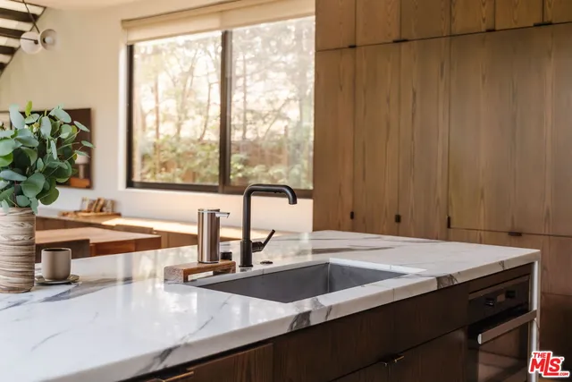 a kitchen with a sink and a window