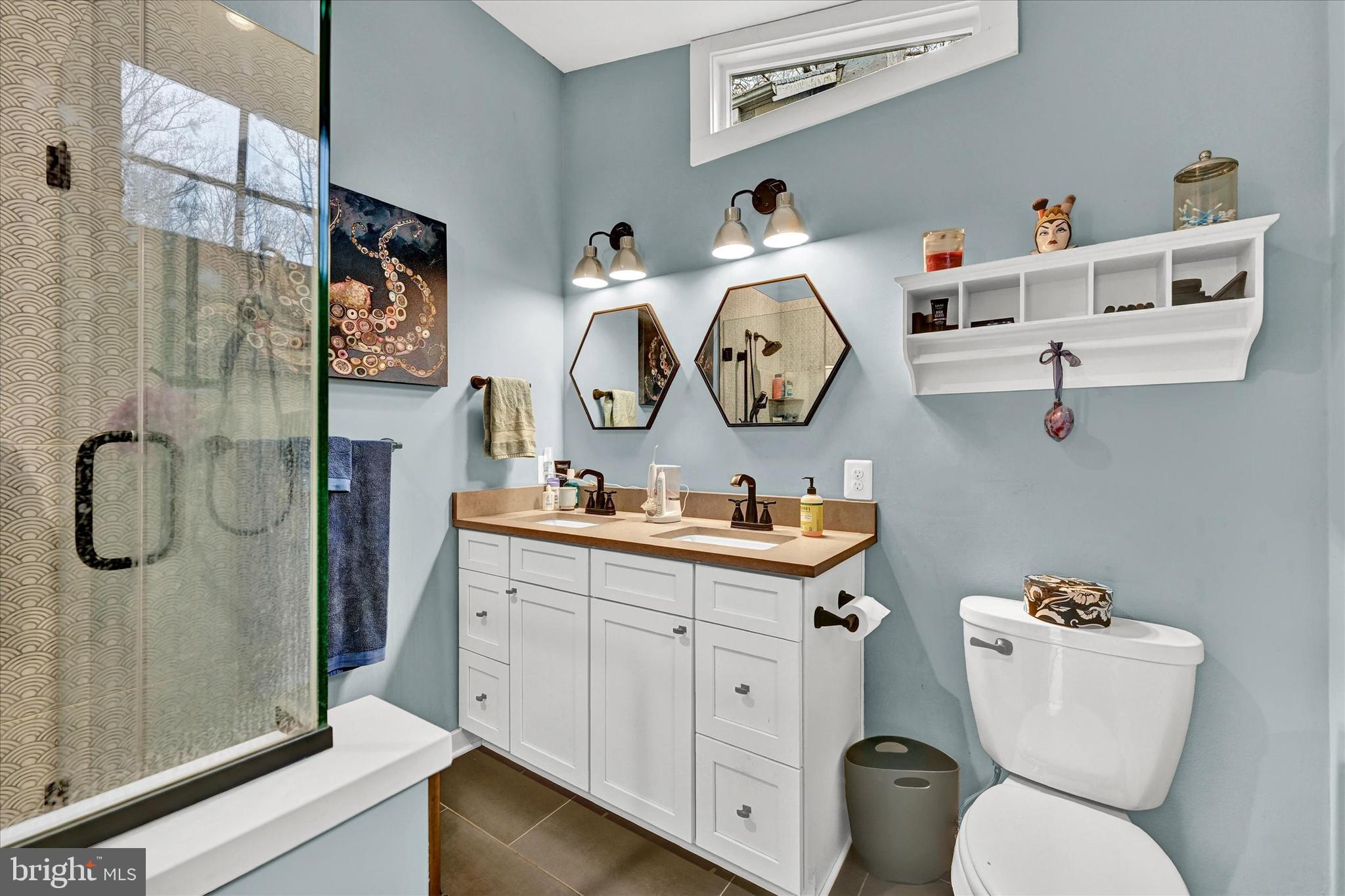 2404 Geist Road Glyndon, MD 21136 - Photo 29 of 63 a bathroom with a toilet a sink and a mirror