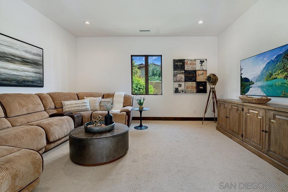 6702 St Andrews Road Rancho Santa Fe, CA 92067 - Photo 11 of 17 a living room with furniture and a flat screen tv