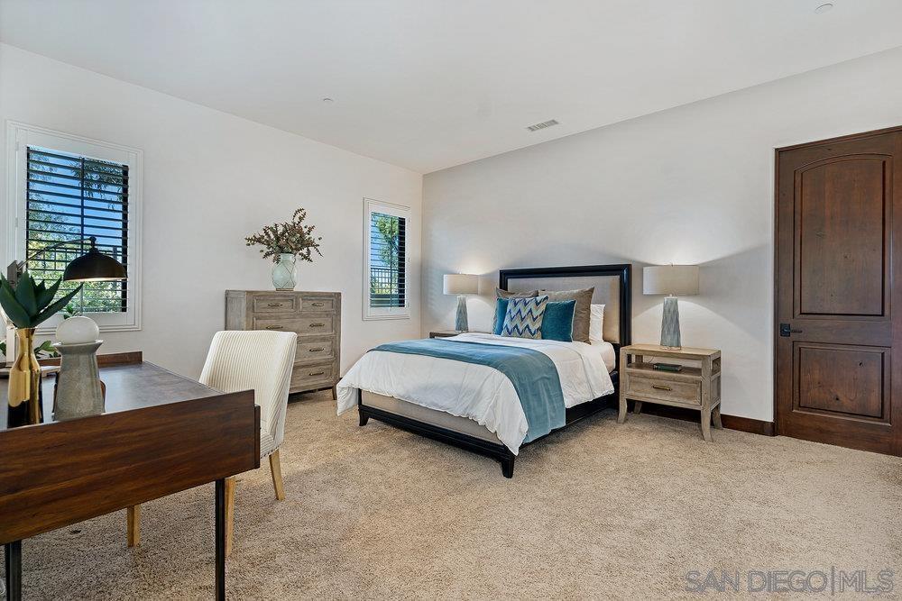 6702 St Andrews Road Rancho Santa Fe, CA 92067 - Photo 12 of 17 a bedroom with a bed and a table