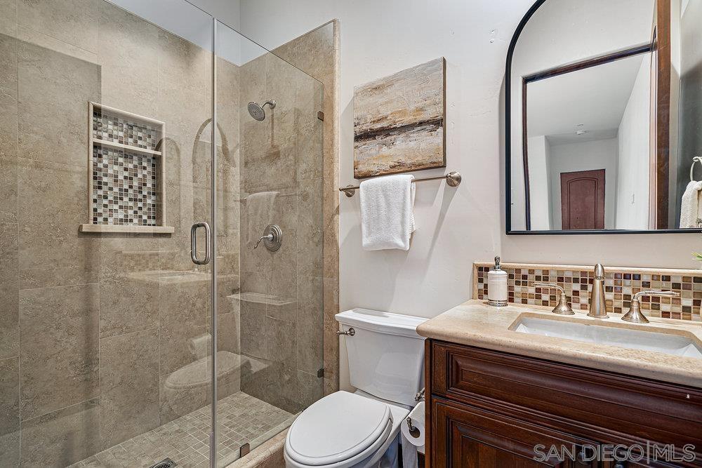 6702 St Andrews Road Rancho Santa Fe, CA 92067 - Photo 13 of 17 a bathroom with a sink toilet and shower