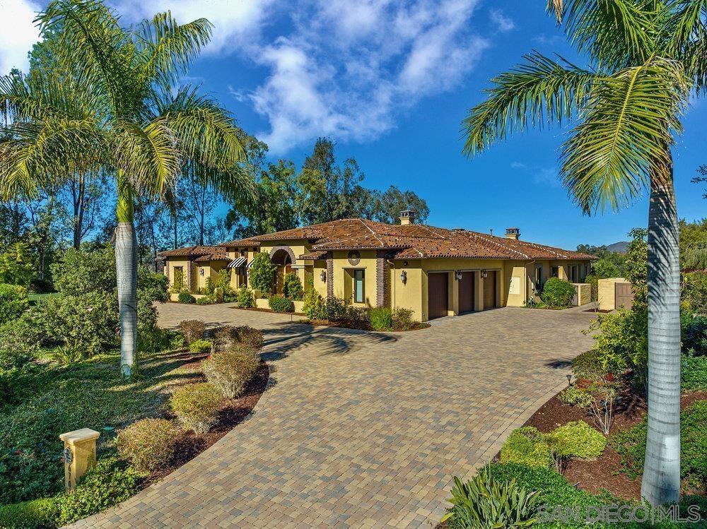 6702 St Andrews Road Rancho Santa Fe, CA 92067 - Photo 15 of 17 a view of a house with a yard