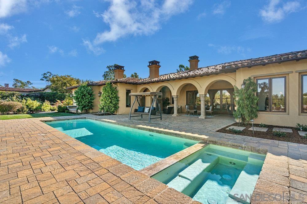 6702 St Andrews Road Rancho Santa Fe, CA 92067 - Photo 16 of 17 a front view of a house with yard and green space