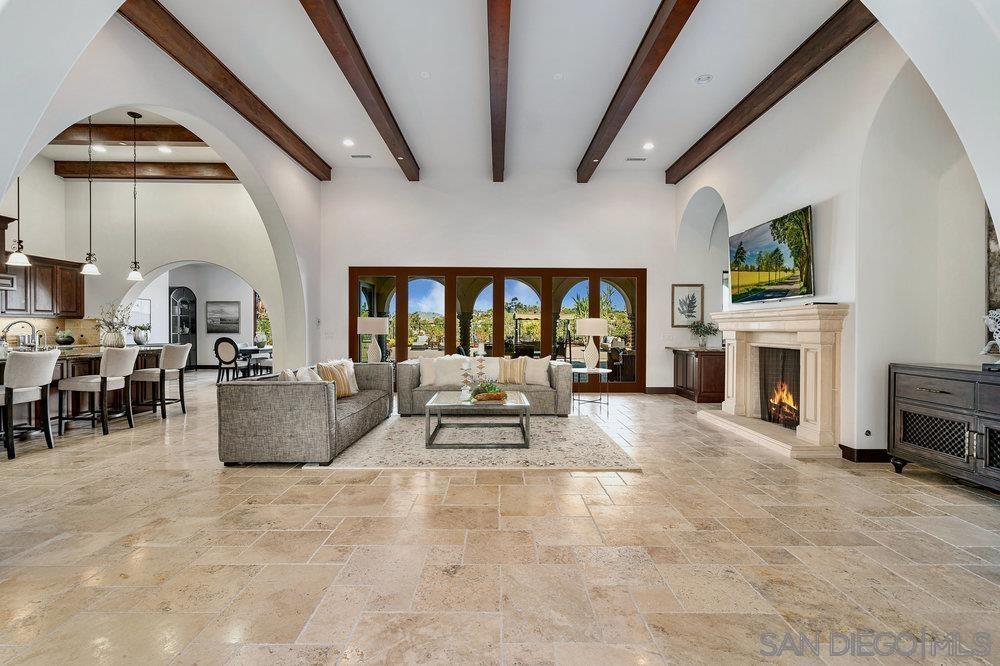 6702 St Andrews Road Rancho Santa Fe, CA 92067 - Photo 3 of 17 a living room with furniture and a fireplace