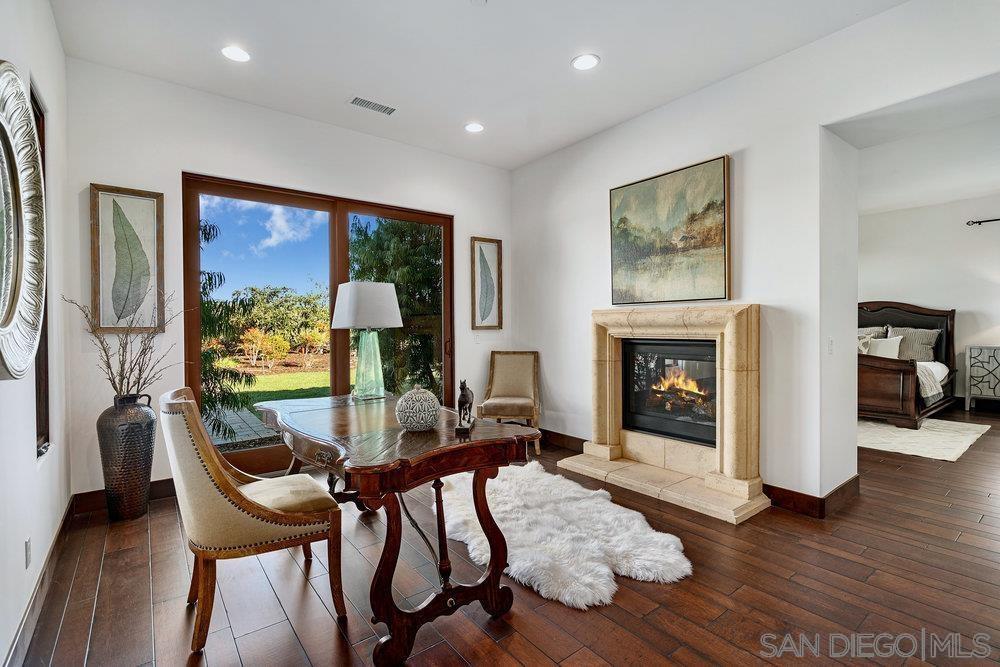 6702 St Andrews Road Rancho Santa Fe, CA 92067 - Photo 8 of 17 a living room with furniture and a fireplace