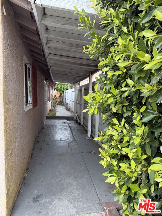 13173 Judd Street Pacoima, CA 91331 - Photo 5 of 9 a hallway with a bunch of flowers