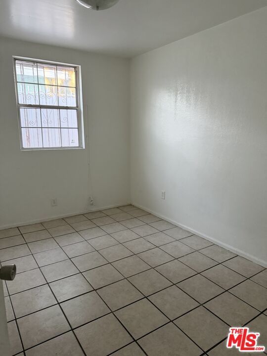 13173 Judd Street Pacoima, CA 91331 - Photo 7 of 9 an empty room with windows