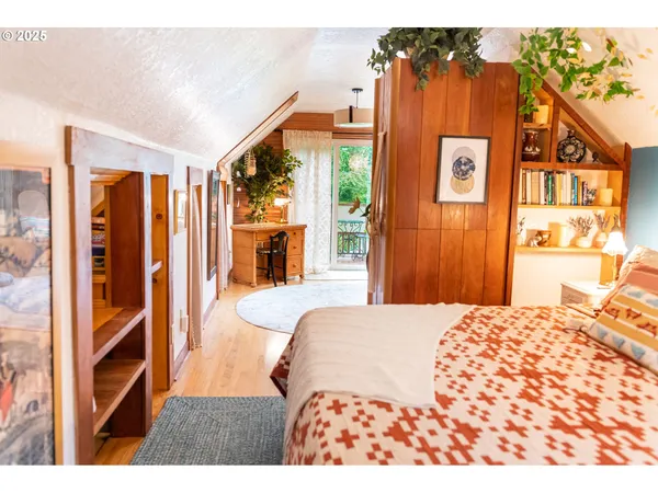 a bedroom with a bed and a book shelf