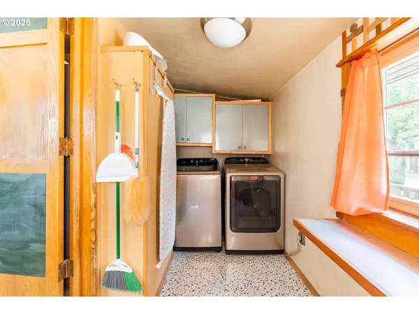 a kitchen with a refrigerator and a stove
