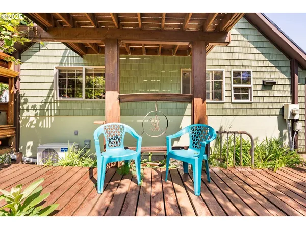 a view of a deck with table and chairs with wooden floor