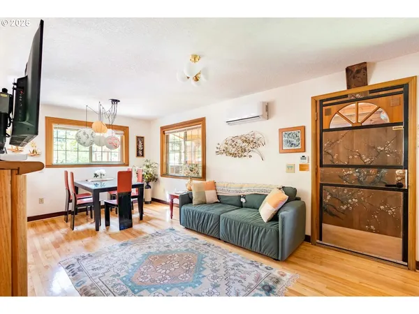 a living room with furniture and a window