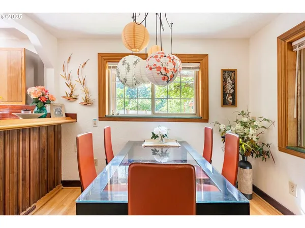 a dining room with furniture and window