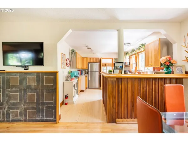 a living room with couches and a flat screen tv
