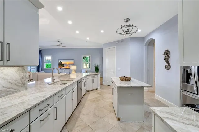 an aerial view of a house with garden space and trees all around