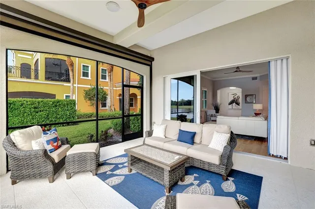 a living room with a floor to ceiling window and pool table