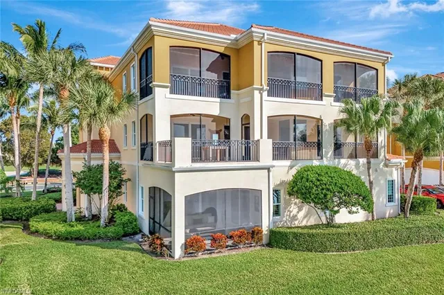 a view of a lake with houses in the back