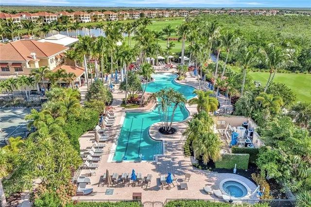 an aerial view of a house with a garden and swimming pool
