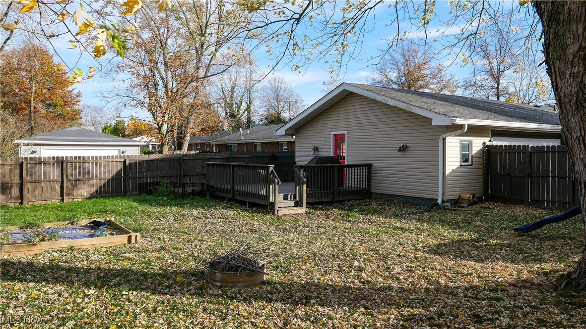 1503 Old Forge Road Kent, OH 44240 - Photo 29 of 38 Back of property featuring a wooden deck and a yard