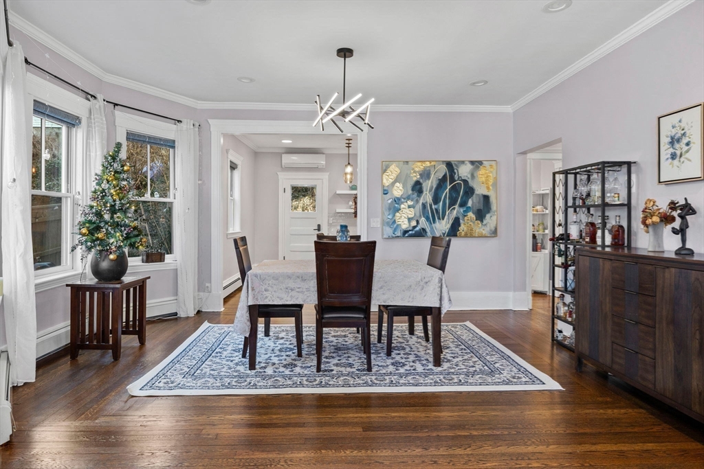 62 Atherton Road, Unit 1 Brookline, MA 02446 - Photo 8 of 24 a view of a dining room with furniture window and wooden floor