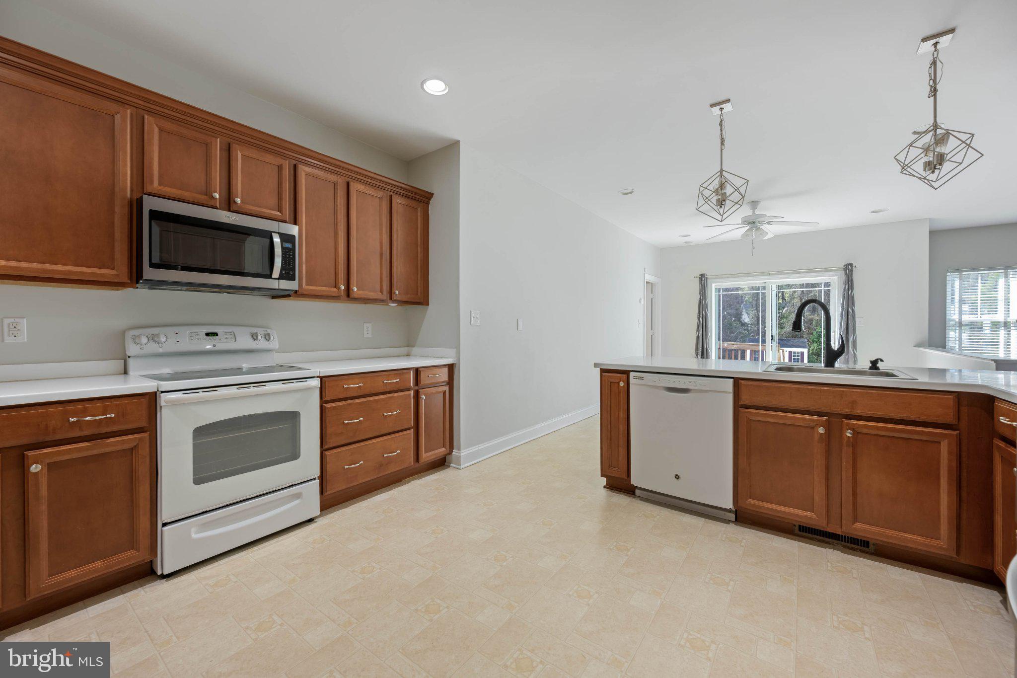 28751 Valley View Lane Lewes, DE 19958 - Photo 18 of 38 Modern kitchen with warm wood accents.