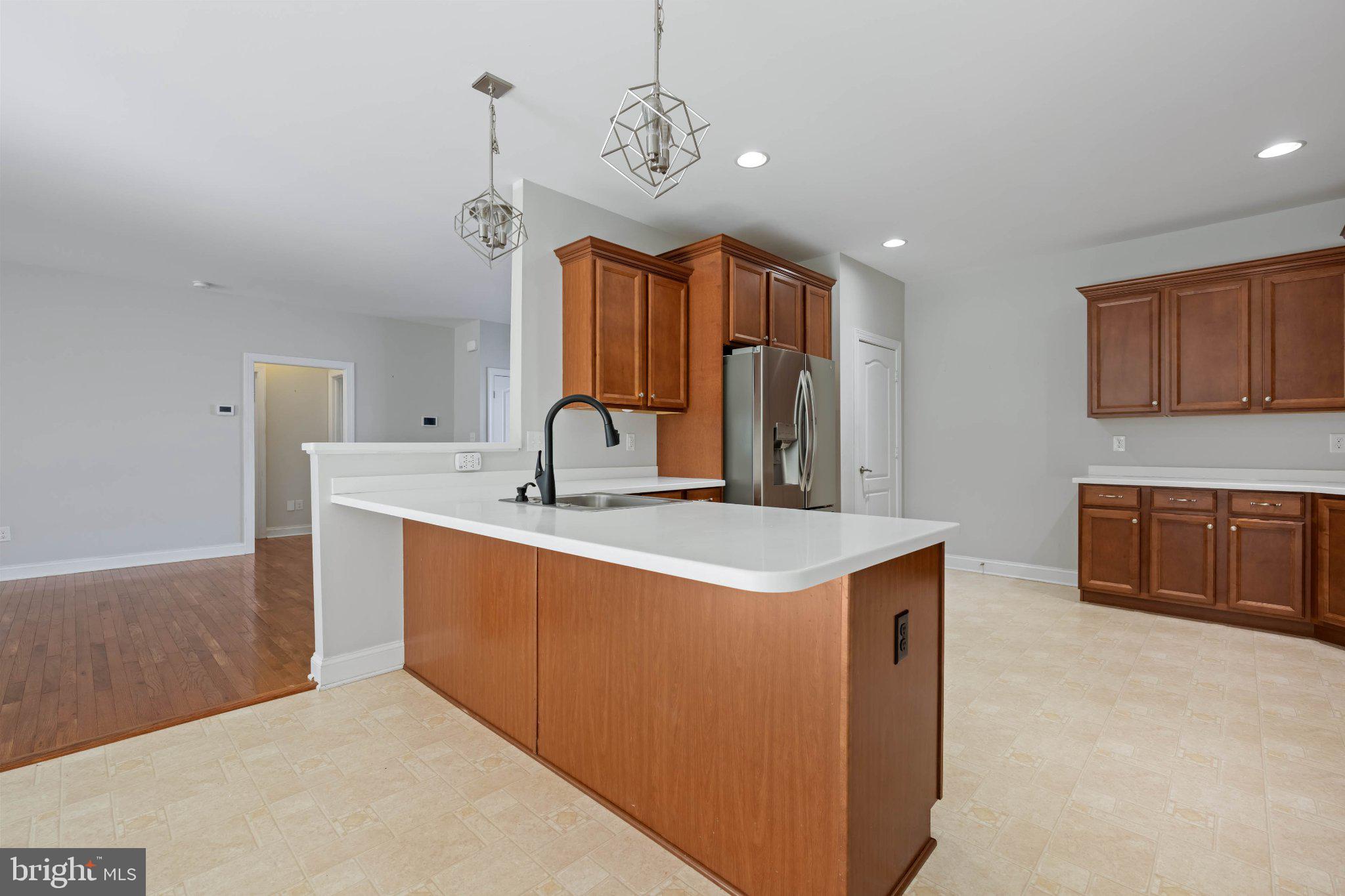 28751 Valley View Lane Lewes, DE 19958 - Photo 20 of 38 Modern kitchen with warm wood accents.