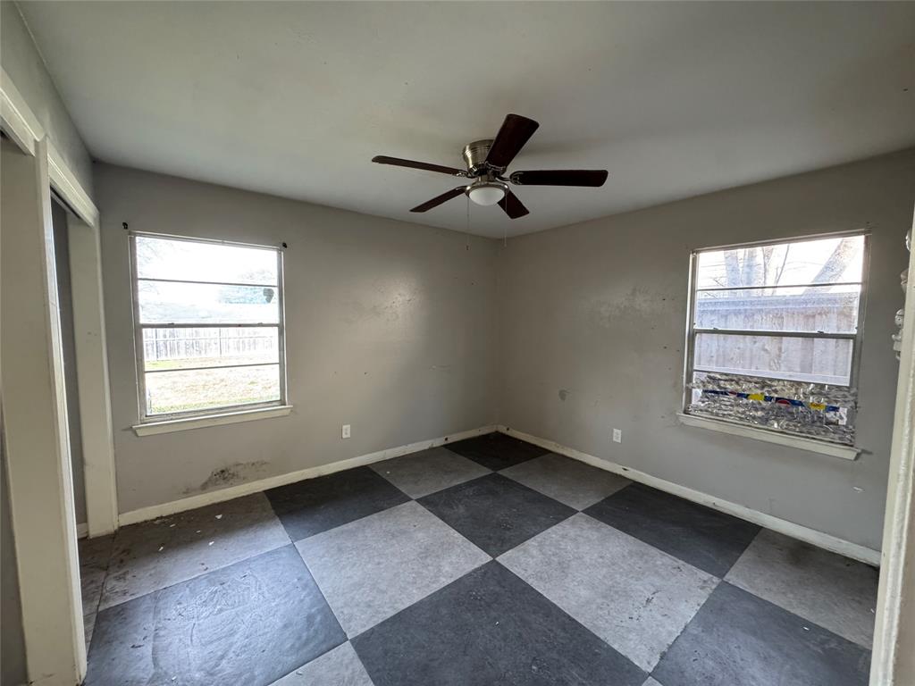 625 Midvale Drive Dallas, TX 75232 - Photo 8 of 11 a view of an empty room with a window