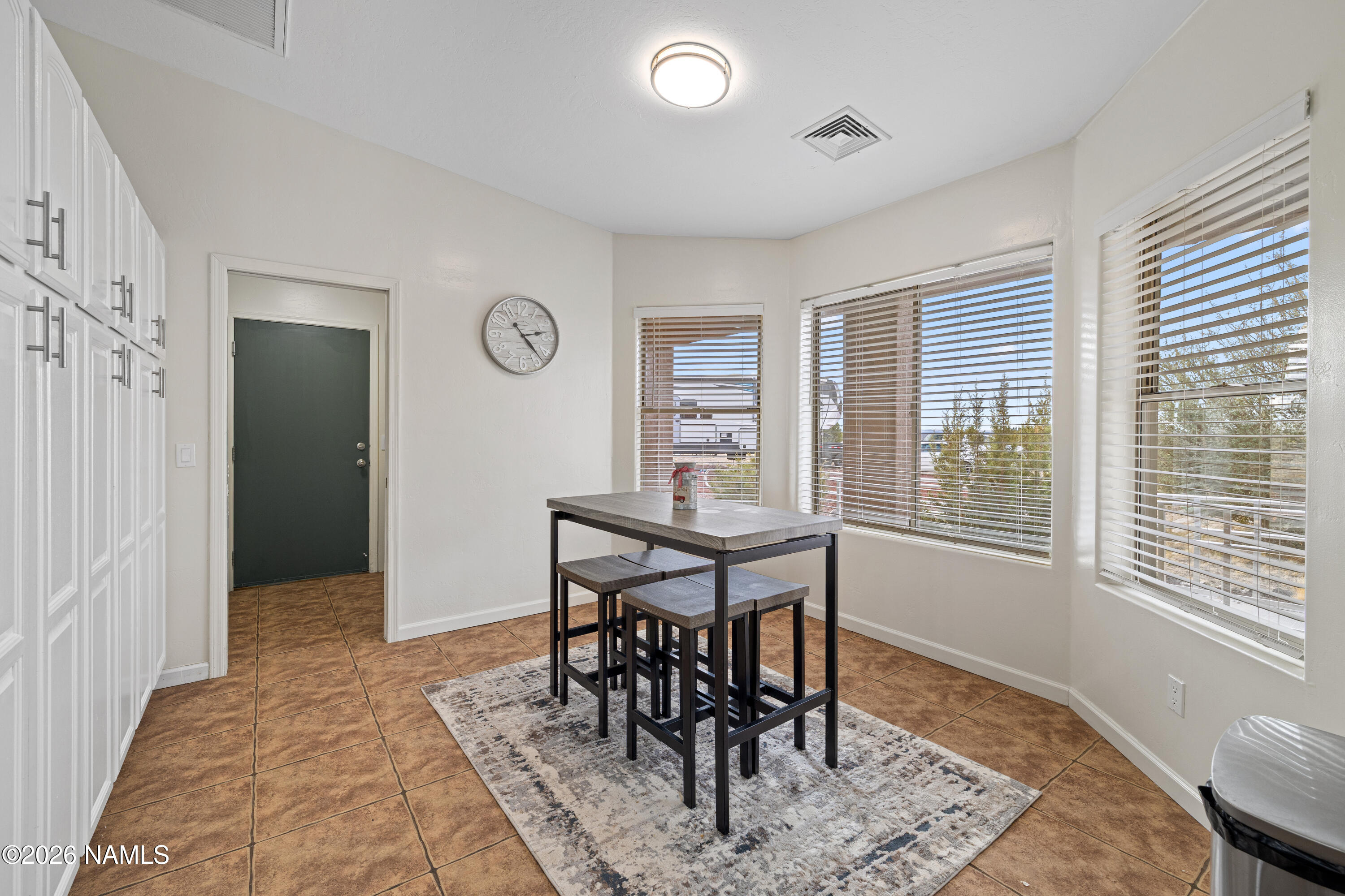 3097 Whitetail Loop Williams, AZ 86046 - Photo 12 of 46 a view of a dining room with furniture and a window