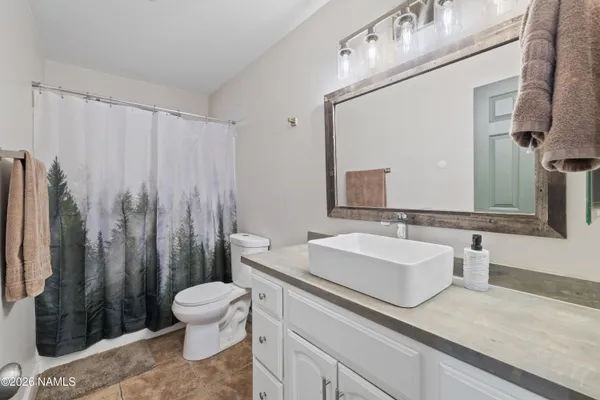 a view of a living room and bathroom