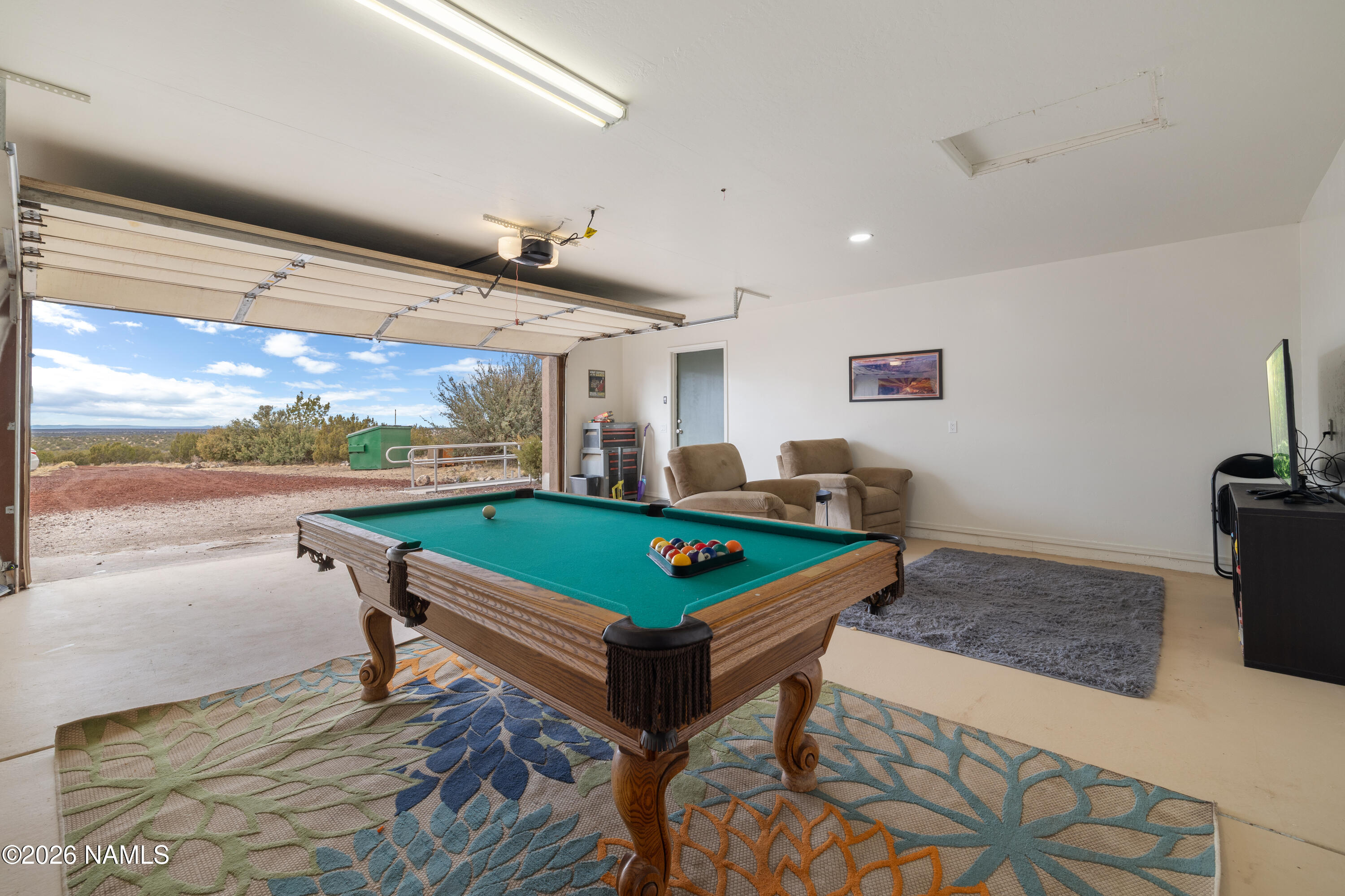 3097 Whitetail Loop Williams, AZ 86046 - Photo 26 of 46 a room with furniture pool table and a flat screen tv