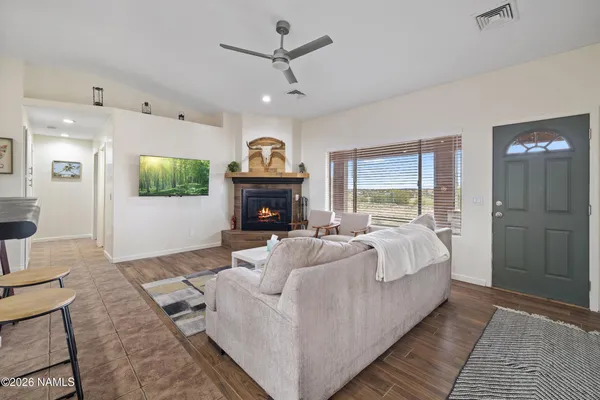 a bed room with furniture and a fireplace